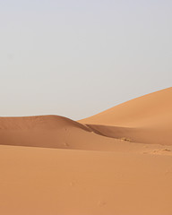 Minimal landscape photography of sand dunes in the Merzouga Sahara desert - Morocco