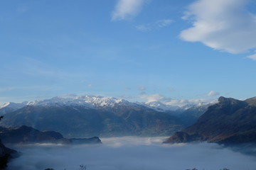 Fototapeta na wymiar Foggy view of Alps on the way from Malbun to Vaduz in Liechtenstein
