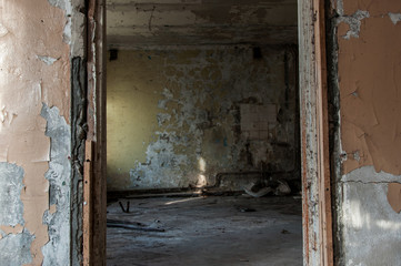 abandoned hotel building. long old corridor of an abandoned building. horror interior. ruined walls.