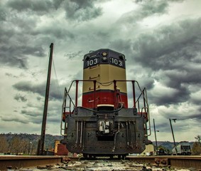 Train engine with dramatic cloudy background