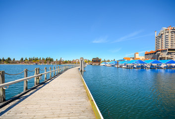 Springtime view of the the docks, boat slips and resort at Coeur d'Alene, Idaho, including the world's longest floating boardwalk.