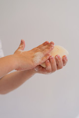 Children wash their hands with soap. Soap on hands. Child washes hands with soap. Girl washes hands with soap.