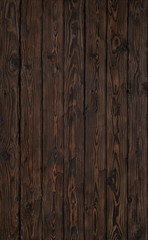 Old wood dark brown burned plank board of pine