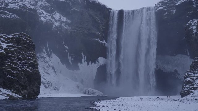 Sk&oacute;gafoss waterfall during the Icelandic winter.
