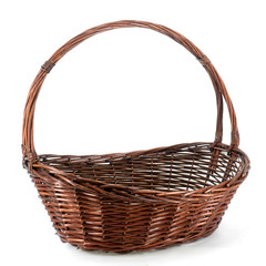 Fototapeta na wymiar Oval brown wicker basket for flowers and gifts on the white background