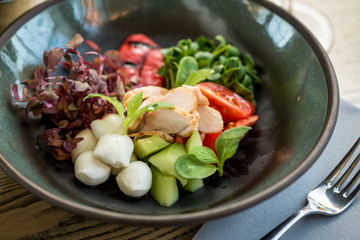 Salad with chicken breast, avocado, mozzarella