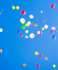 colorful balloons flying in the blue sky