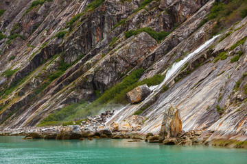 slanting rocks and water in fjord