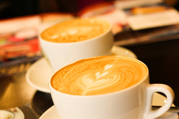 Two cup of coffee with milk