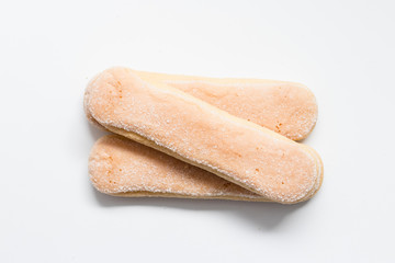 Ladyfinger biscuits for Tiramisu isolated on white background. Savoiardi italian sponge biscuits close up