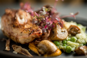 Duck breast with rice, green peas, mushrooms