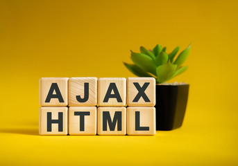 AJAX HTML - text on wooden cubes, green plant in black pot on a yellow background