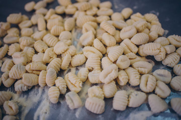 Fresh pasta, fruits and vegetables on wooden table
