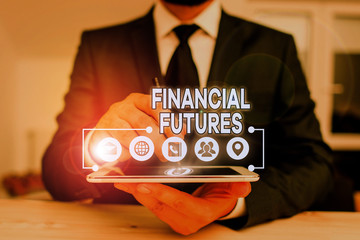 Conceptual hand writing showing Financial Futures. Concept meaning contract to buy or sell...