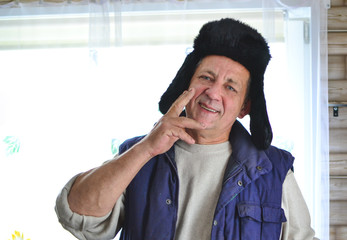 Fototapeta na wymiar Happy russian man offering a vodka, cheers. Studio portrait isolated on white background