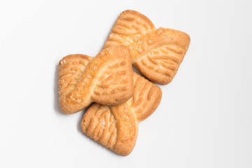 Freshly baked sugar cookies on white background in top view