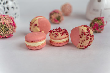 Macaron cake of different colors of large size in a beautiful layout on a light white background