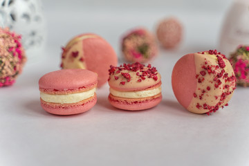 Macaron cake of different colors of large size in a beautiful layout on a light white background