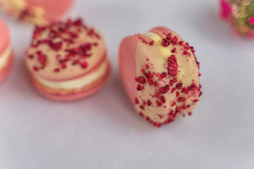 Macaron cake of different colors of large size in a beautiful layout on a light white background