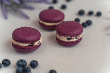 Macaron cake of different colors of large size in a beautiful layout on a light white background