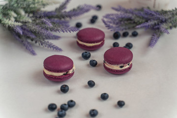 Macaron cake of different colors of large size in a beautiful layout on a light white background