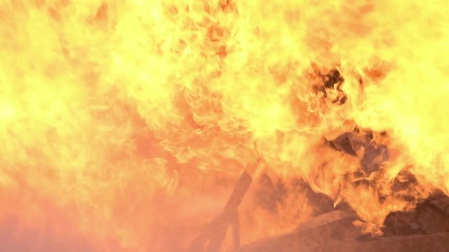 Big real fire.The car is burn down.Burning car infernal fire in auto accident with big flame flare and smoke . Looping Fire Flames spark in auto.  Fire wall flame after Car explosion in slow motion.