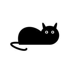 Black cat lies with a surprised look on a white background.