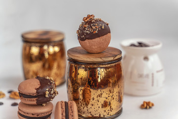 Macaron cake of different colors of large size in a beautiful layout on a light white background