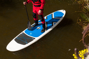 SUP silhouette sports man paddle boarding