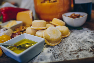 Fresh pasta, fruits and vegetables on wooden table