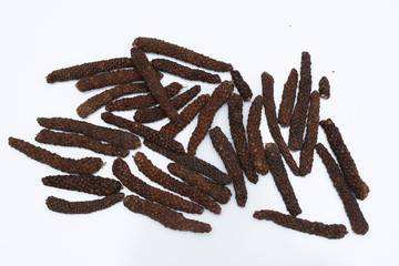 Long pepper or Piper longum on white background
Long black pepper (Also called as Pipli in Indian, capsicum frutescens, Balinese pepper, Jaborandi pepper, Bengal pepper, Dipli in Thai, Piper longum)