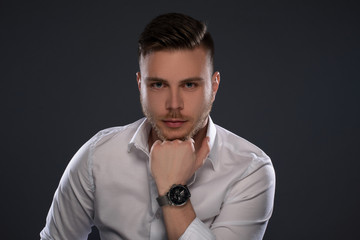 Portrait of beautiful man on grey background. Studio Isolated
