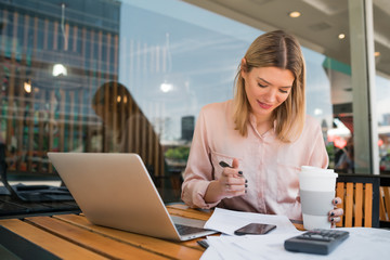 Young businesswoman working on her laptop.