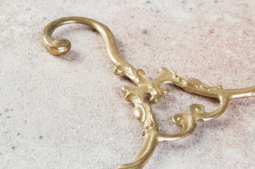 Antique brass clothes hanger