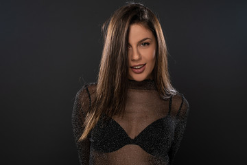 Naklejka premium Portrait of girl posing in studio on grey background. Isolated