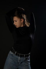 Obraz premium Girl posing sexy expression in studio on black background. Isolated