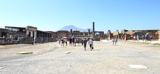 Pompeii Ruins. It was buried under ash in the eruption of Mount Vesuvius in 79. Its a UNESCO World Heritage Site. Vesuvius in Distant Backlground