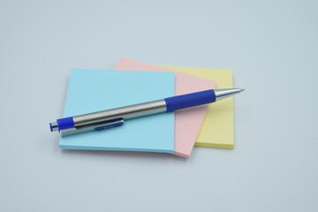 colorful sticky notes with pen on white background