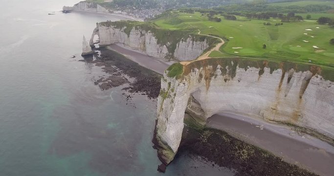 Etretat in Normandy, France. Clify white work of nature, photos from the drone, view of the rocks, beaches, green fields, sea and sun shot in the early season, summer, footage 4k25ftp