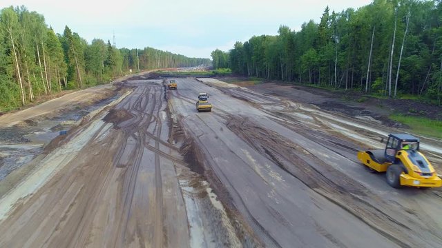 Development new road transport Highway. Aerial View of construction equipment.