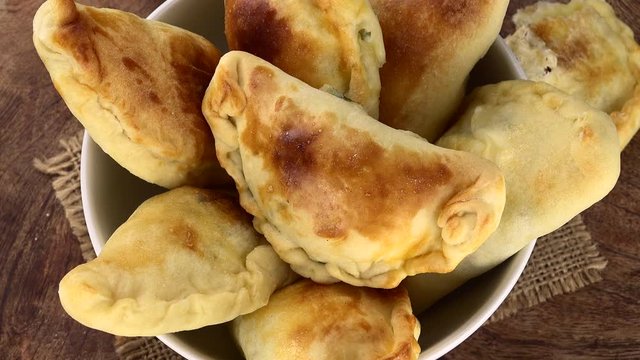 Homemade Empanadas on a rotating plate (seamless loopable)