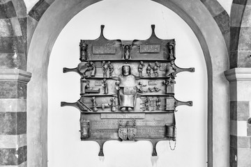 Singular funeral plate made of wrought iron with figures in relief. Innichen Cemetery, Italy,