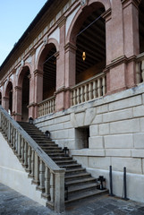 Detail of facade with imposing staircase of an old Italian villa.