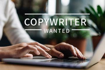 Freelancer copywriter using laptop, typing on keyboard, edit something, working from home 