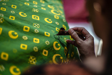 Solo Indonesia, April 27 2020 : Close Up Hand Painting Gold Batik on the Fabric