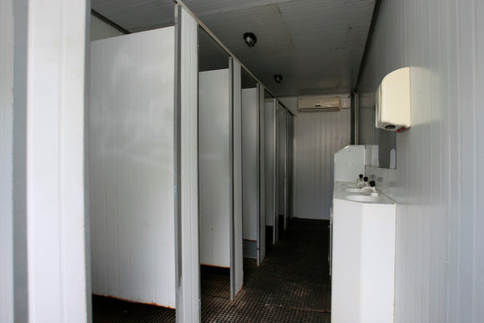 person using toilet in the street