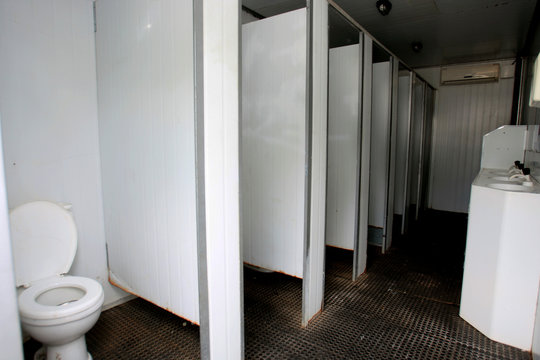 person using toilet in the street