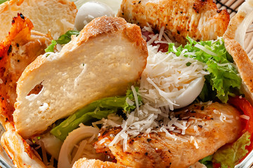 Caesar salad top view closeup food background