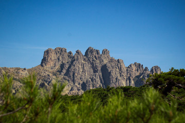 Fototapeta na wymiar Mountains and forested valley of Bavella in Corsica, France