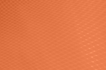 abstraction background: unique wavy pattern of overlaying two grids, blurred and tinted to salmon color